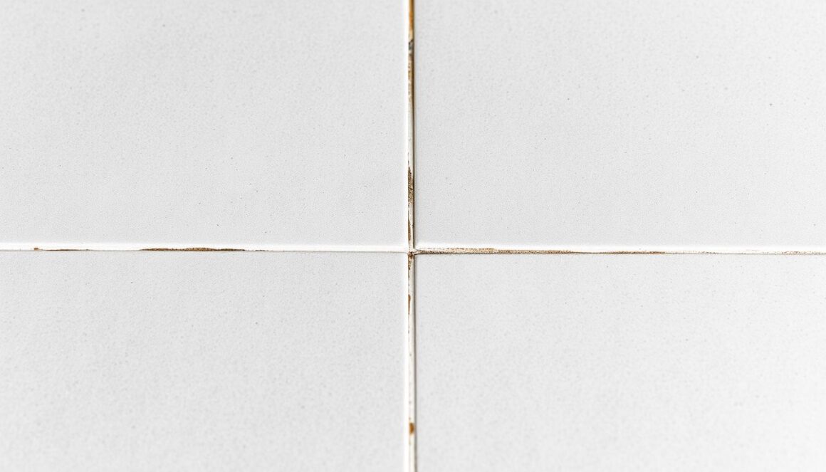 How to keep grout clean Clean white grout next to dark dirty grout on porcelain kitchen tile